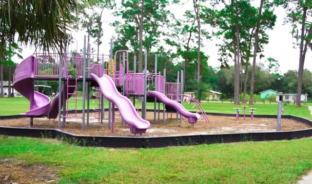 Slides and climbing features at Kid Jones Park in LaBelle, Florida